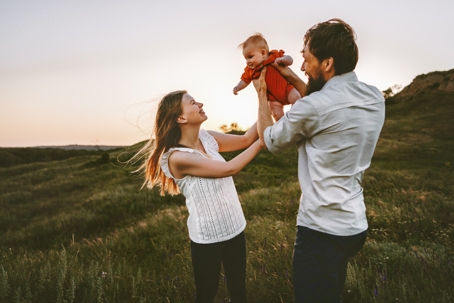 Mom and dad holding baby